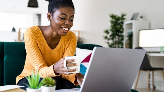 Smiling woman working at home