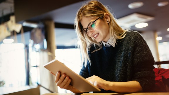 Student studying remotely on tablet pc