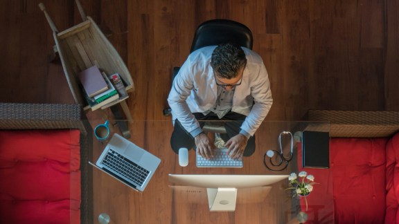 Doctor working at desk in office