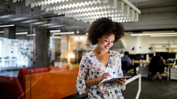 Close up of a female architect using a tablet