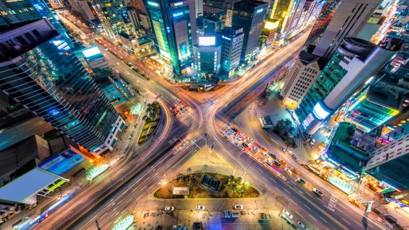 Looking down on a major interstection at night in Seoul, South Korea.