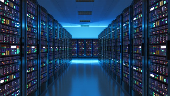 Modern web network and internet telecommunication technology, big data storage and cloud computing computer service business concept: server room interior in datacenter in blue light