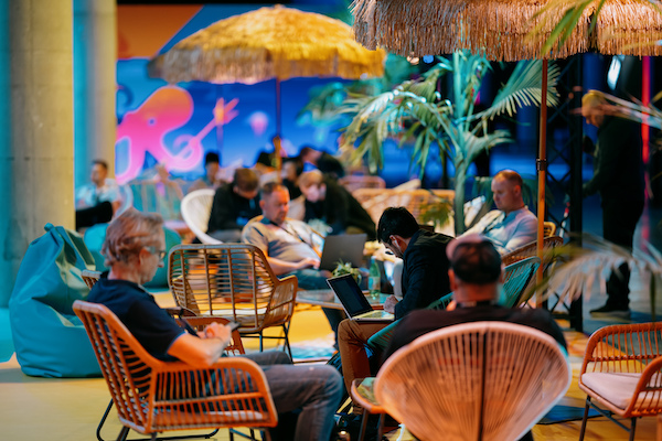 Attendees in the jungle lounge at VMware Explore 