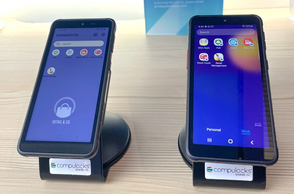 A closeup of two smartphones, showing demo frontline work apps.